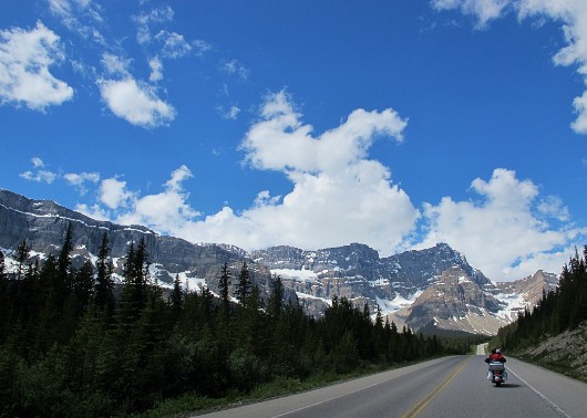 Motorcycling in the Canadian Rockies on an Orange & Black motorcycle tour